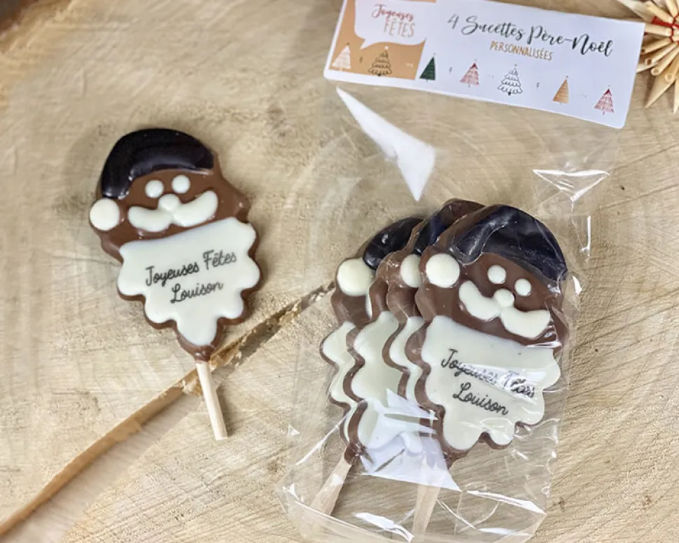 Lot de 4 sucettes Père Noël en chocolat au lait dont 2 personnalisées